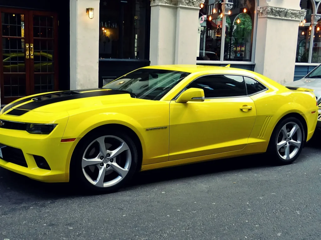 Yellow car featuring custom black stripe decals installed in San Antonio