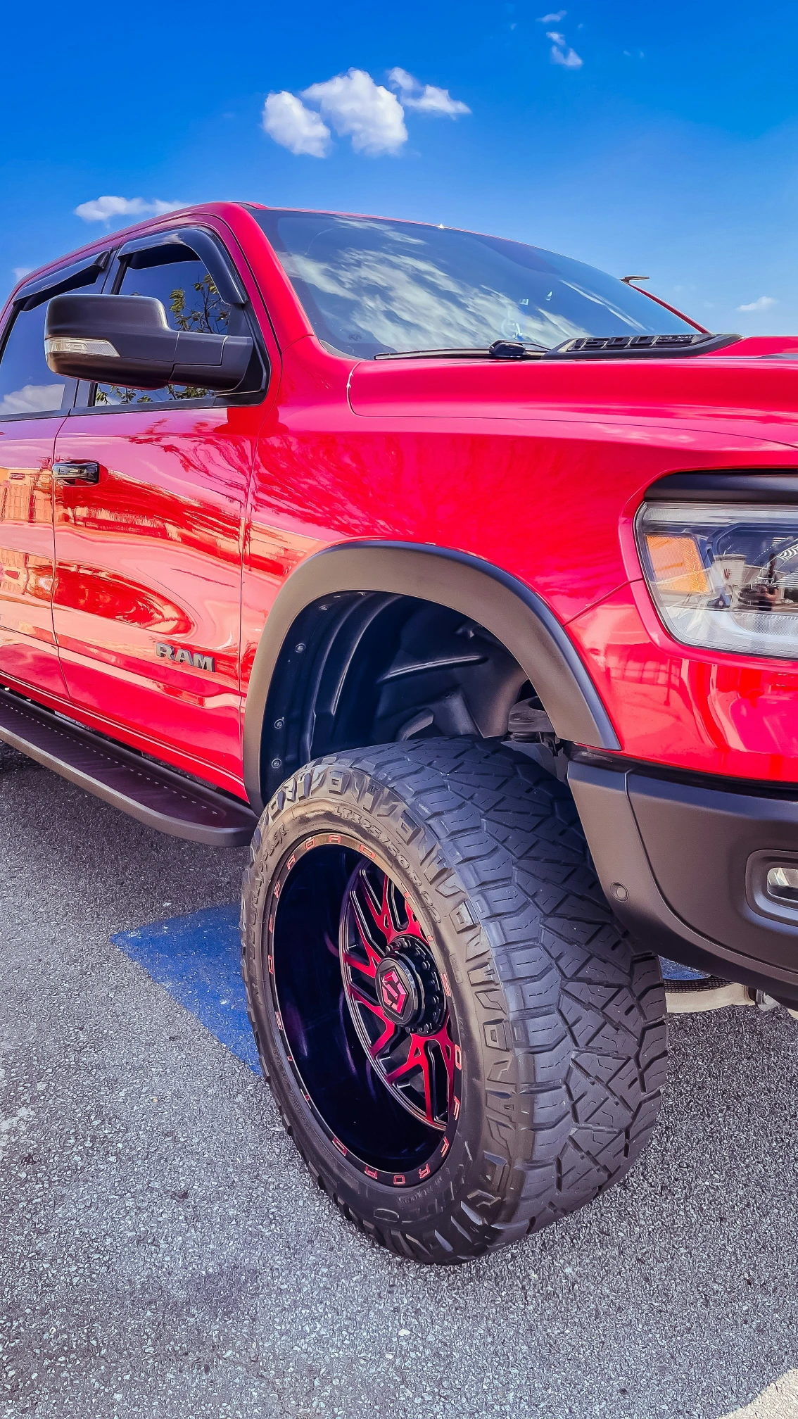 Red RAM 1500 with a custom truck wrap in San Antonio
