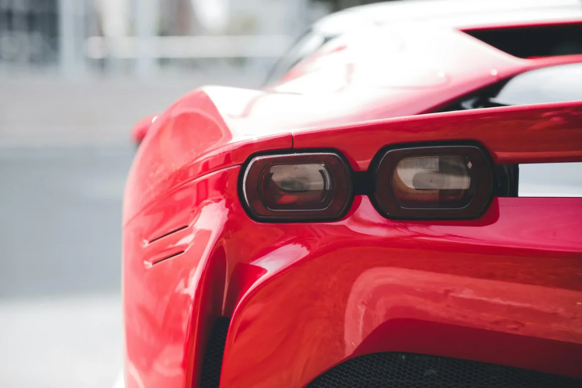 Close-up of a red car’s rear showing a clean, glossy finish from a vinyl wrap in San Antonio Texas